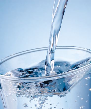 pouring water into cup